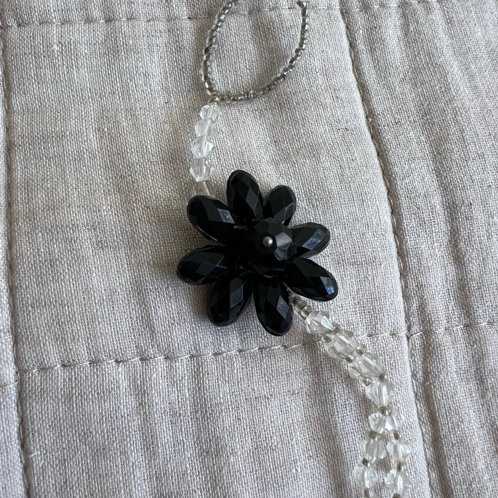 Toe chain anklet with a black flower